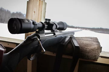 Foto op Plexiglas Closeup of a rifle bolt and scope while hunting © Amelia