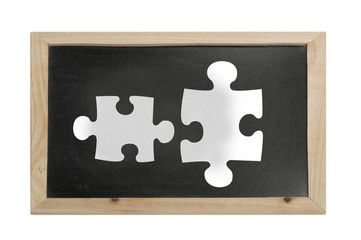 Puzzleteil auf Tafel - Symbolfoto für Team