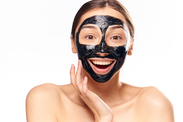 Black coal cosmetic face mask, woman on white isolated background