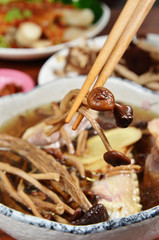 Home made steamed chicken and agrocybe aegerita mushroom soup on the table
