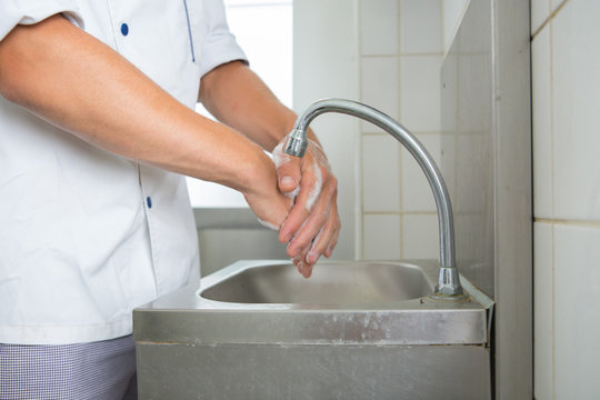 worker washing hands