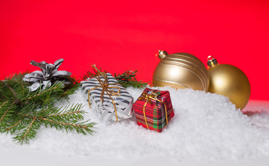 Gift wrapping, Christmas tree bump and yellow Christmas tree ball on snow