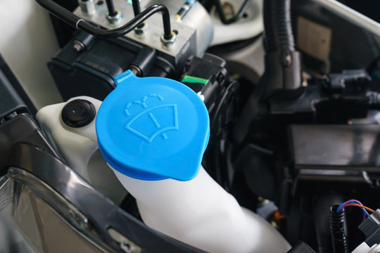 Car engine windshield washer fluid reservoir cap close-up