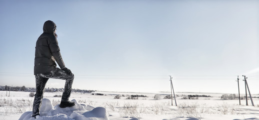 silhouette people stand in winter field in sunny day