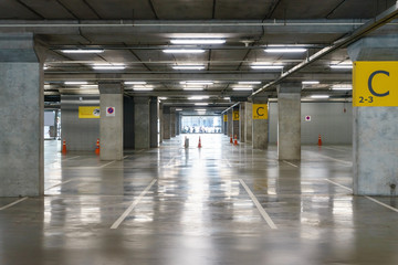 interior of parking garage with vacant parking lot in parking building,