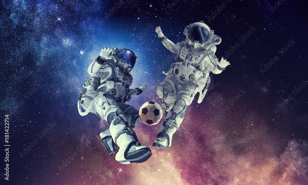 Wall mural astronaut play soccer game