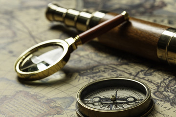 Fototapeta na wymiar Retro compass with old map and spyglass