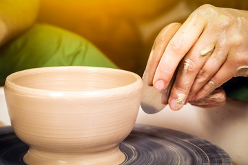 Fototapeta na wymiar Close-up of a woman potter sclulpt clay