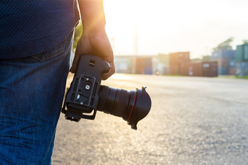 photographer, hand hold camera