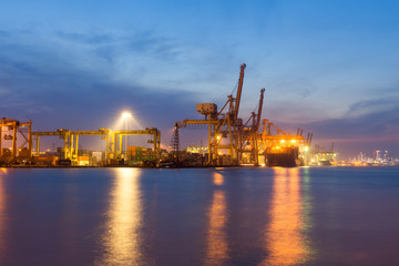 Fototapeta premium Aerial top view of container ship in import export and business logistic.By crane , Trade Port