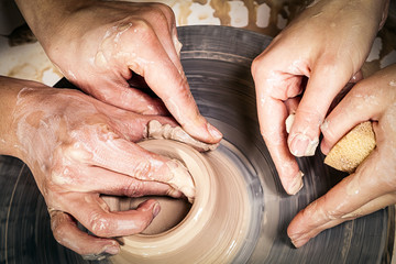 Close-up of a  woman potter sclulpt clay