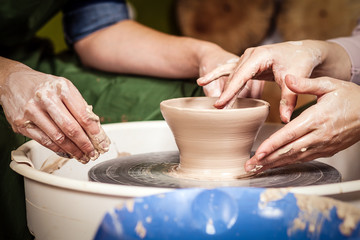 Close-up of a  woman potter sclulpt clay