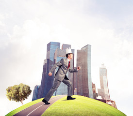 King businessman in elegant suit running on green globe with mod