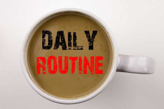 Word, writing Daily Routine text in coffee in cup. Business concept for Accuracy Procedure on white background with copy space. Black text with red word.