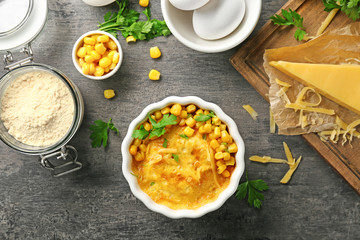 Ramekin with corn pudding on table