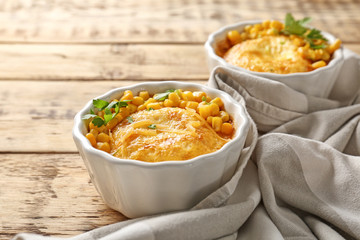 Ramekins with corn pudding on table