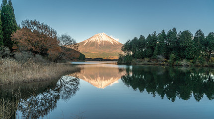 Beautiful clear sky Sunset at Tanuki Lake (Tanukiko). Fuji mountain reflections, first snow in...