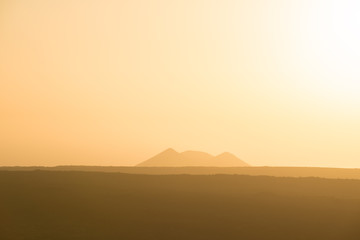 Lonely volcano in the national park of Timanfaya at sunset. Lanzarote. Canary Islands. Spain