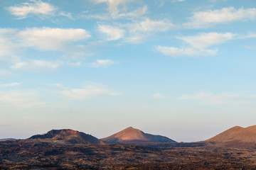 Naklejka premium Incredible volcanic landscape of Lanzarote at sunset. Canary Islands. Spain.