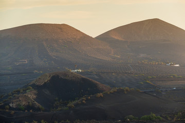 Incredible volcanic landscape of Lanzarote at sunset. Canary Islands. Spain.