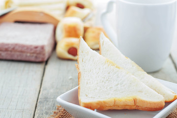 Bread in plate on table.