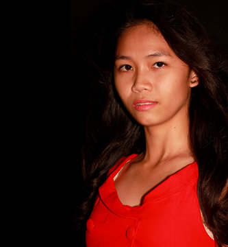 Young pretty Filipina model looking at the camera
