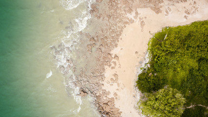 Fototapeta na wymiar Top view aerial image from drone of an stunning beautiful sea landscape beach with turquoise water with copy space for your advertising text