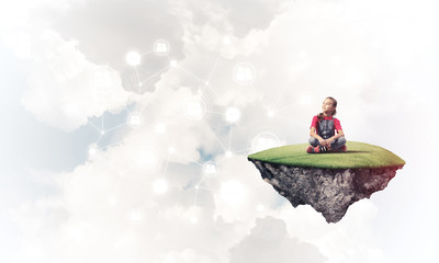 Concept of careless happy childhood with girl dreaming about som