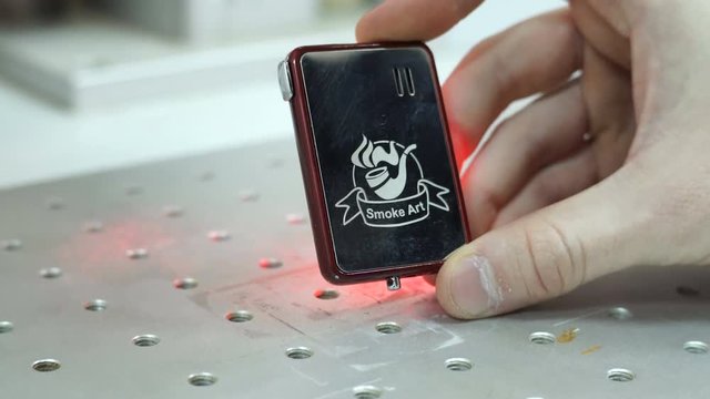 Demonstration of laser engraving on the lighter. Laser engraving on metal.