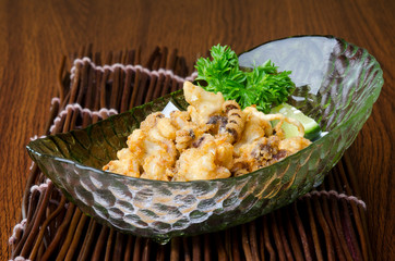 japanese cuisine. fried squid on the background