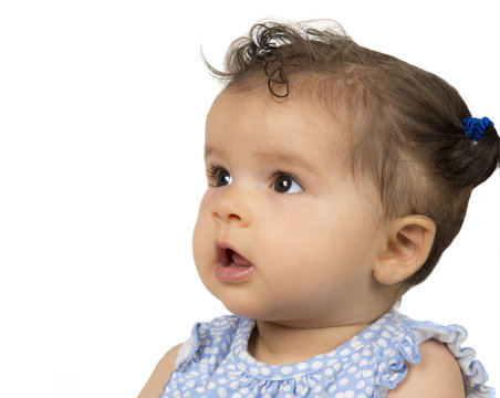 Beautiful mixed race, baby girl in profile on white background