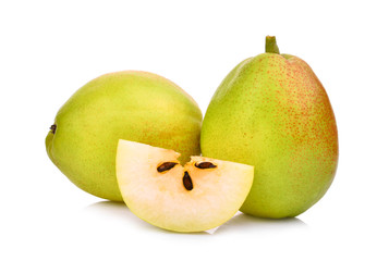 two whole and slice of green fragrant pear isolated on white background