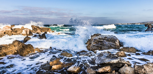 The spray of the sea in the morning sun
