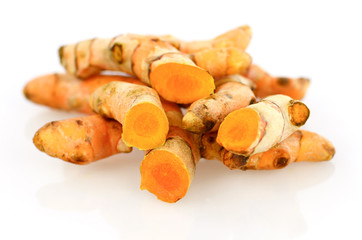 Turmeric roots on white background