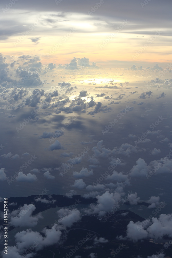 Canvas Prints sunset white cloud sky at high level attitude, view from window airplane