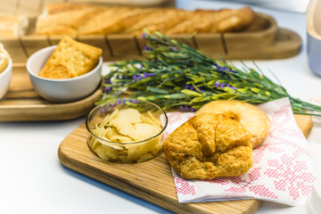 Bread on wooden table, ready for cooking. Concept of food preparation, kitchen on background.