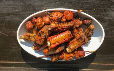 Grilled meat on white dish