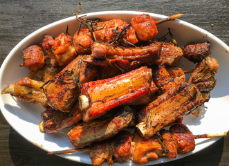Grilled meat on white dish