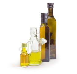 Different bottles of the various vegetable oil on white background