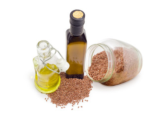Two different bottles of linseed oil and linseeds