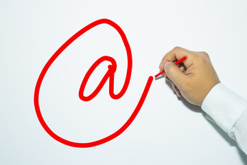 Man's hand writing with pencil the word: E-mail sign