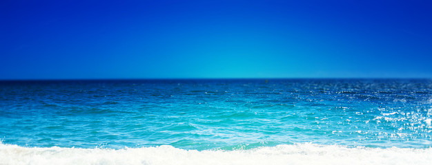 Sea Beach and Soft wave of blue ocean.  Summer day and sandy beach background, beauty nature.