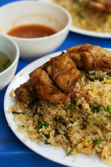Vietnamese Food with rice chicken and spice sauce