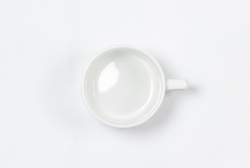 empty porcelain mug isolated on white background