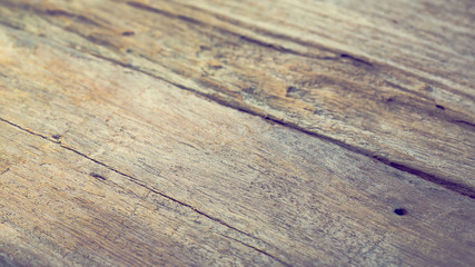 Top wooden table with detailed textured look clean, soft and warm , copyspace use as background for product display.