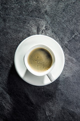 The coffee cup.