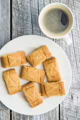 Sweet cookies and coffee cup.