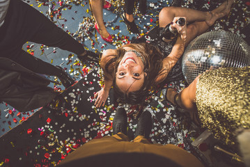 Party people celebrating in the club © oneinchpunch