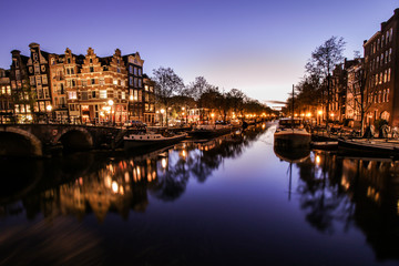 Fototapeta na wymiar Reflections in the canals of Amsterdam after sunset