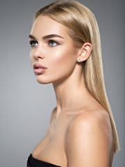 Profile portrait of young woman with long light straight  hair. © Valua Vitaly
